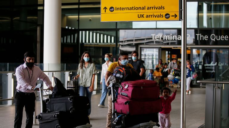 LONDON, ENGLAND - AUGUST 22: Travellers arrive at Heathrow Airport on August 22, 2020 in London, England. As of Saturday morning at 4am, travellers arriving in England from Austria, Croatia, and Trinidad and Tobago were required to quarantine themselves for 14 days. At the same time, travellers from Portugal were no longer required to quarantine. (Photo by Hollie Adams/Getty Images)