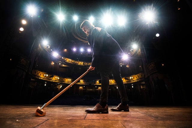 Peter Baker, who plays Trigger in the musical version of Only Fools and Horses, sweeps the stage of the Theatre Royal Haymarket in London, after observing a 15 minute silence to show solidarity with those in the theatre industry that have lost their jobs due to the coronavirus pandemic