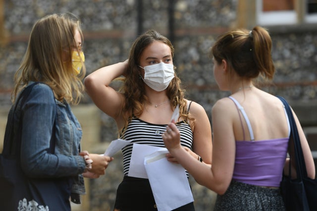 Benita Stipp (centre) and Mimi Ferguson (left) react as students at Norwich School receive their A-Level results