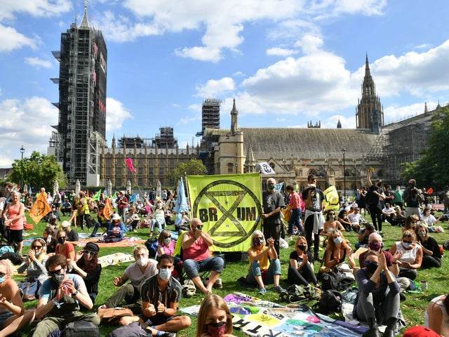 Extinction Rebellion protesters sitting outside The Houses of Parliament in Westminster, London