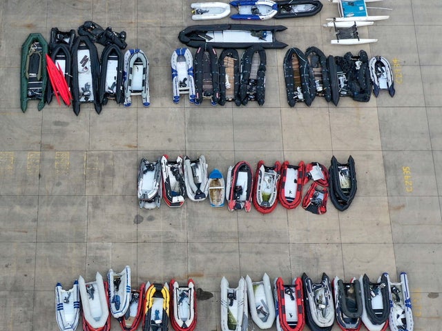 A view of small boats thought to be used in migrant crossings across the Channel at a storage facility in Dover, Kent