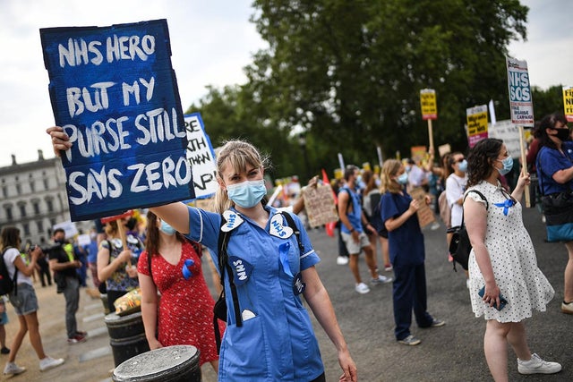 Healthcare workers take part in a protest in London over pay conditions in the NHS