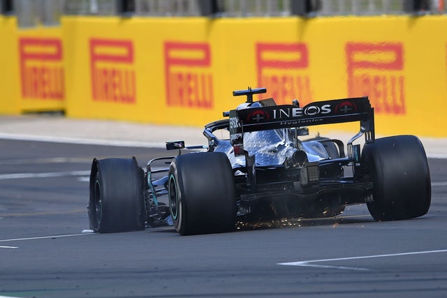 Lewis Hamilton drives with a puncture towards the finish line to win the Formula One British Grand Prix at Silverstone 