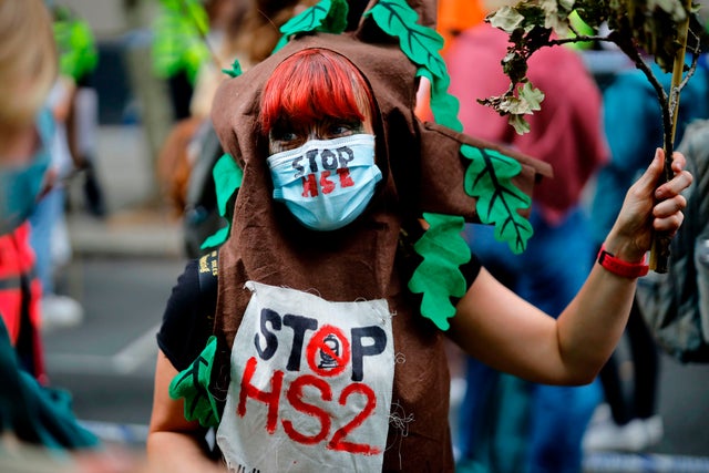 Activists take part in a demonstration against the HS2 hi-speed rail line outside the Department of Transport