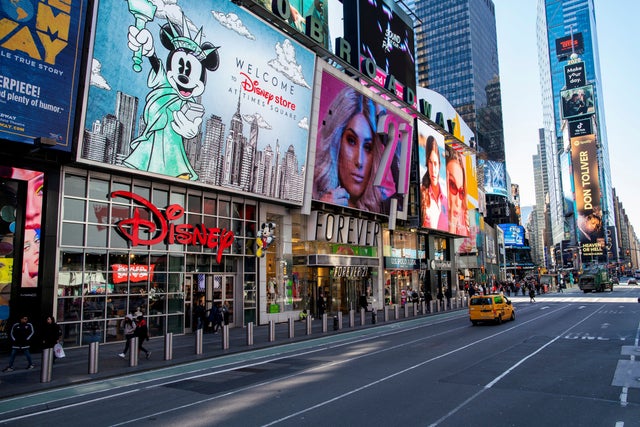 A cab drives down at Seventh Avenue in Times Square