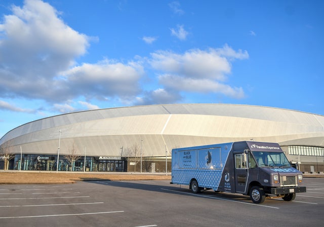 A mobile souvenir shop sits in an empty parking lot at Allianz Field as a match between the New York Red Bulls at Minnesota United FC is postponed