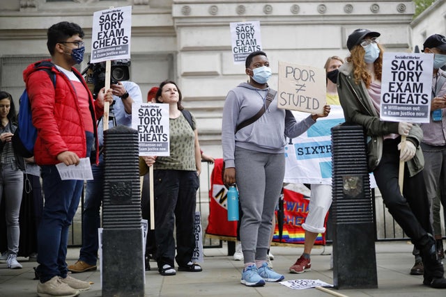 People including students hold placards on Whitehall outside Downing Street as they protest against the downgrading of A-level results. The government faced criticism after education officials downgraded more than a third of pupils' final grades in a system devised after the coronavirus pandemic led to cancelled exams yes