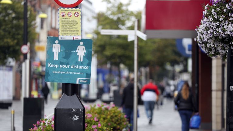 Shoppers on the High Street in Slough as the Berkshire town has been put back onto the government watch list because of a rise in coronavirus cases.