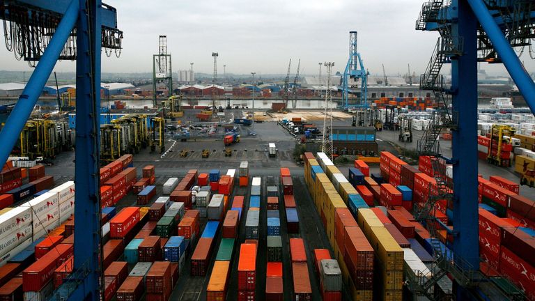 Ship freight containers sit on Tilbury Dock