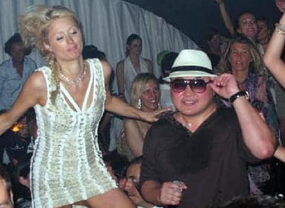 Party animal: Jho Low (pictured with socialite Paris Hilton) is subject to an Interpol red alert, and is believed to be hiding in China