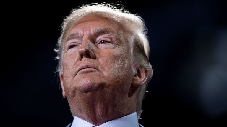 US President Donald Trump looks on from the stage during a Keep America Great Rally at Kellogg Arena December 18, 2019, in Battle Creek, Michigan. (Photo by Brendan Smialowski / AFP) (Photo by BRENDAN SMIALOWSKI/AFP via Getty Images)