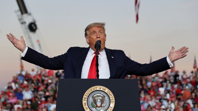 U.S. President Donald Trump speaks during a campaign rally, his first since being treated for the coronavirus disease (COVID-19), at Orlando Sanford International Airport in Sanford, Florida, U.S., October 12, 2020. REUTERS/Jonathan Ernst TPX IMAGES OF THE DAY