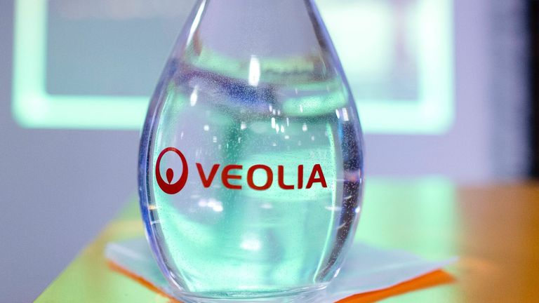 A picture taken on February 26, 2015 shows the logo of French international utility group Veolia Environnement on a water carafe in Paris. 